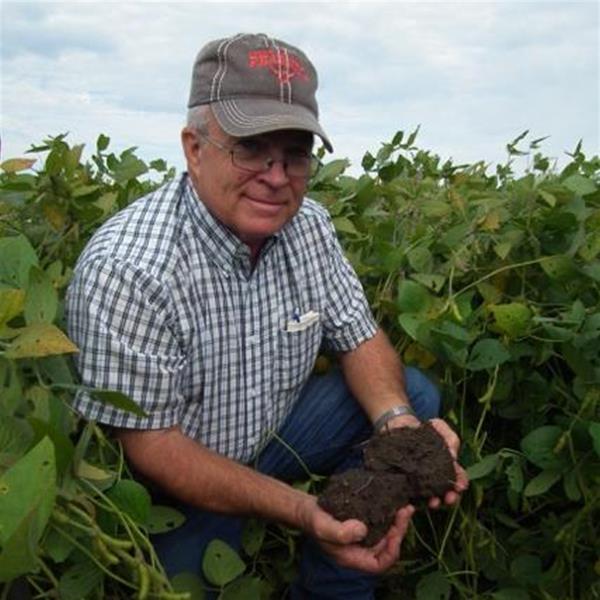 Farmer holding handful of soil