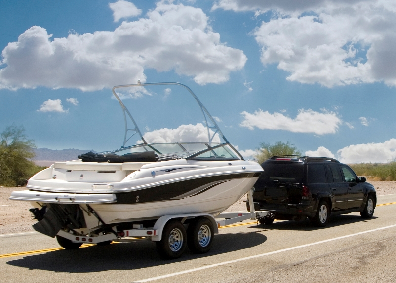 Car towing boat - credit iStock