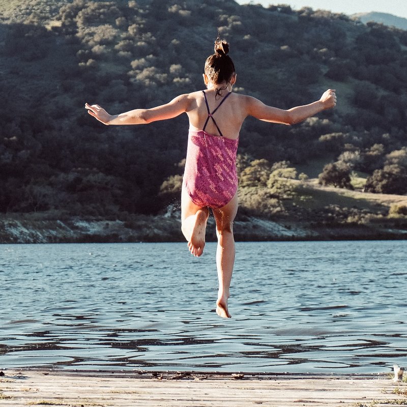 jumping into a lake_credit erik dungan_unsplash