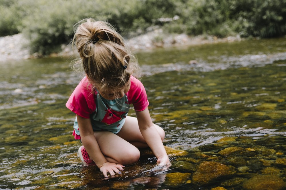 Young girl looking at water