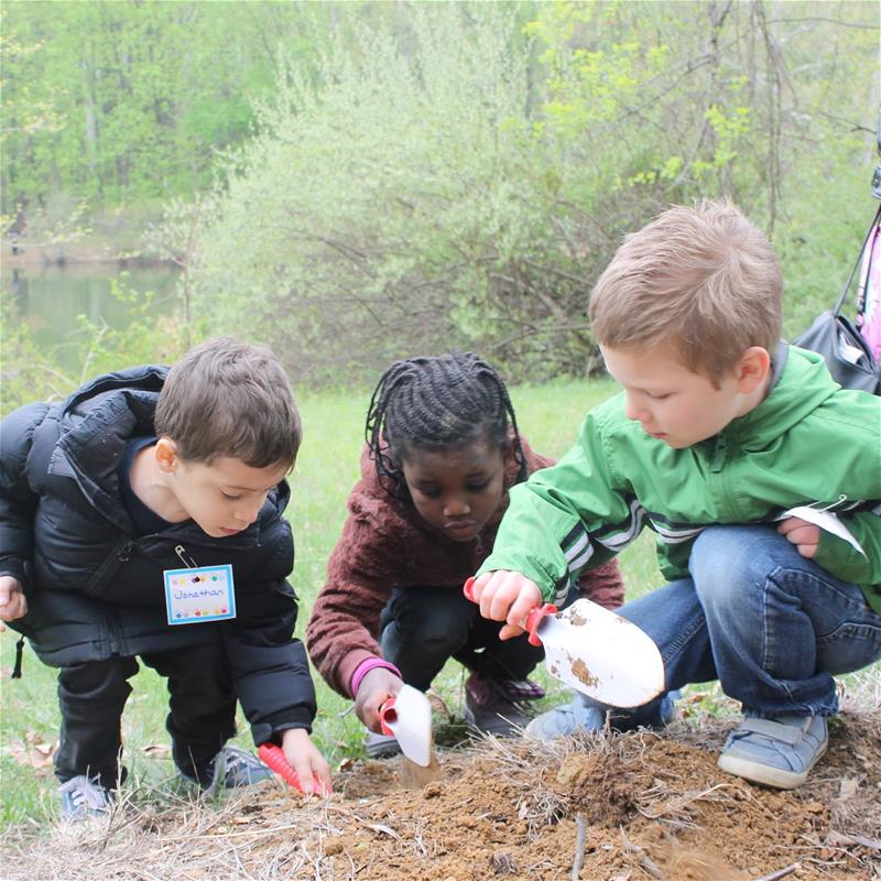 Kids looking at soil