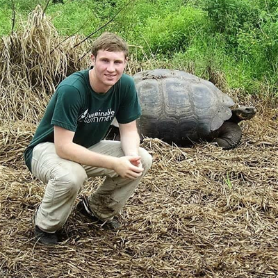 College student with giant tortoise